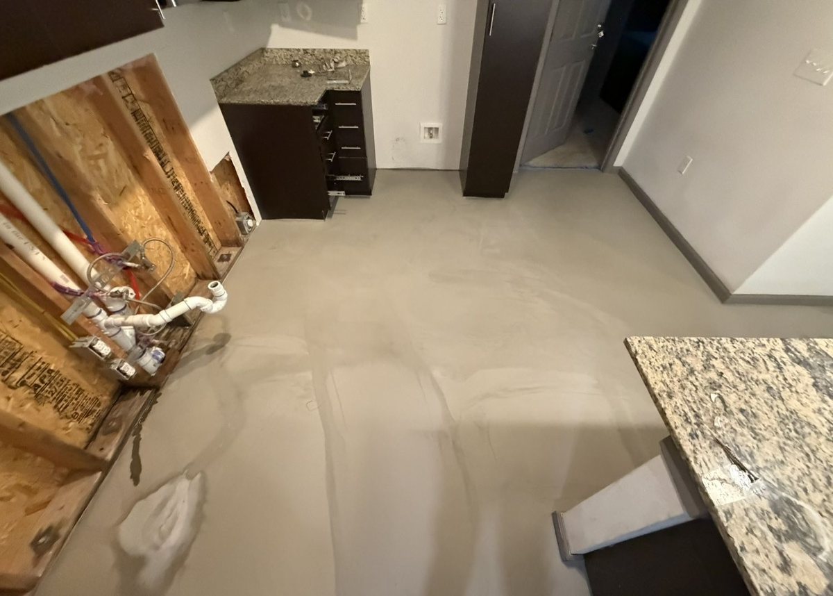 Multifamily unit with self-leveler poured across the slab during demo and prep